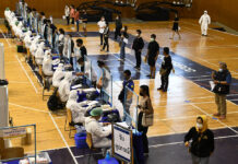 A Curfew by Any Other Name? Nonthaburi ‘Asks’ Residents to Stay Home at Night People line up to take a coronavirus test at Bangkok Youth Center on Apr. 17, 2021.