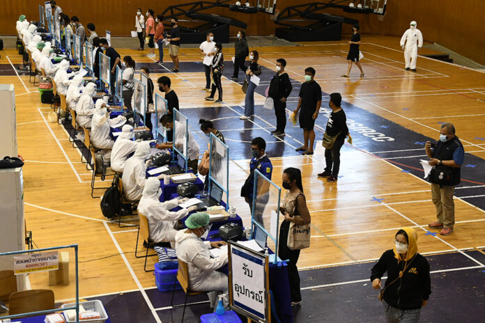 People line up to take a coronavirus test at Bangkok Youth Center on Apr. 17, 2021.