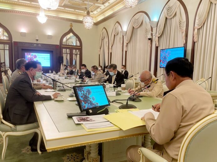 Gen. Prayut Chan-o-cha, right, in a meeting at Government House on April 26, 2021.