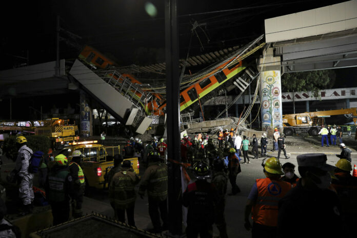 Mexico City's subway cars lay at an angle after a section of Line 12 of the subway collapsed in Mexico City, Tuesday, May 4, 2021. Photo: Marco Ugarte / AP