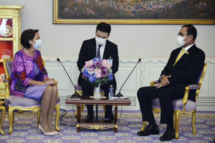 In this photo released by Government Spokesman Office, United Nations Special Envoy to Myanmar Christine Schraner Burgener, left, talks with Thailand's Prime Minister Prayuth Chan-ocha, right, during a meeting at Government House in Bangkok, Thailand, Friday, May 14, 2021. Photo: Government Spokesman Office via AP