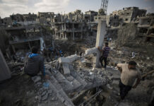 Israeli Military Accused of Using Media to Trick Hamas Palestinians inspect their destroyed houses following overnight Israeli airstrikes in town of Beit Hanoun, northern Gaza Strip, Friday, May 14, 2021. Photo: Khalil Hamra / AP
