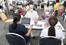 It’s Official: Foreigners Can Register For COVID-19 Vaccinations Next Month People wait to receive AstraZeneca COVID-19 vaccine at Chulabhorn Royal Academy on May 20, 2021.