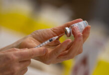 Moderna Vaccines To Be Available In October, With an Extra Charge In this Wednesday, April 14, 2021 file photo, a pharmacist fills a syringe from a vial of the Moderna COVID-19 vaccine in Antwerp, Belgium. Photo: Virginia Mayo / AP