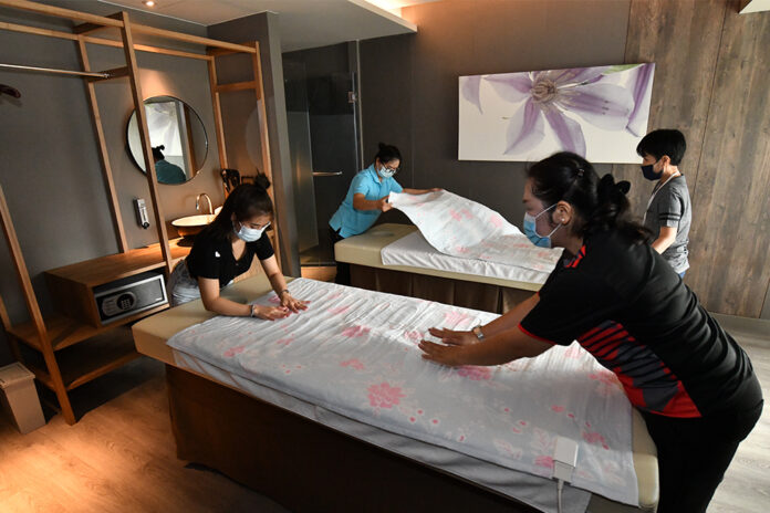 A file photo of workers preparing for the reopening of a spa in Bangkok.