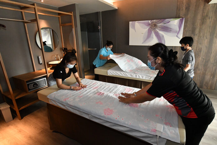 A file photo of workers preparing for the reopening of a spa in Bangkok. A file photo of workers preparing for the reopening of a spa in Bangkok.