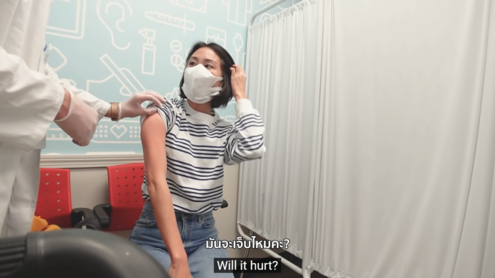 A screenshot of Mint's video shows her getting vaccinated at a CVS Pharmacy in New York City. Image: I Roam Alone / YouTube