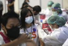 Thailand Reports Record Virus Cases; Delays Bangkok Easing A health worker administers a dose of the Sinovac COVID-19 vaccine to a woman in Bangkok, Thailand, Monday, May 31, 2021. Photo: Sakchai Lalit / AP