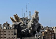 Israeli Official Rolls Back Army Chief Comments on AP Gaza FILE - In this Saturday, May 15, 2021, file photo, an air bomb hits the building housing various international media, including The Associated Press, in Gaza City. Photo: Mahmud Hams / Pool Photo via AP File