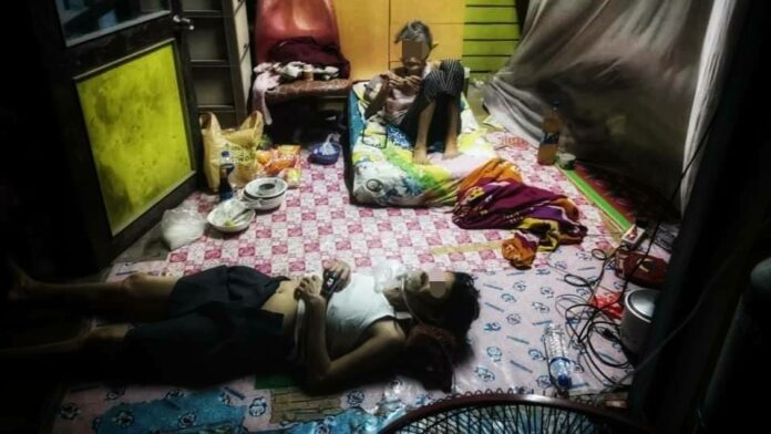 A 57-year-old woman at home July 20, 2021 after becoming infected with COVID-19 but unable to secure a hospital bed. She died after the photo was taken. Her mother, 90, tested positive on July 21, 2021 and managed to get a bed at a state hospitel. Photo: Zendai