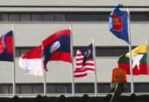 Thailand’s Caretaker Government Criticized for Holding Meeting To Discuss Military-Ruled Myanmar In this April 22, 2021, file photo, flags of some of the ASEAN member countries fly at the ASEAN Secretariat in Jakarta, Indonesia. Photo: Tatan Syuflana / AP File
