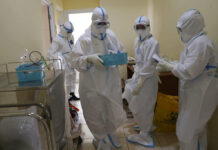Rapid Virus Spread Through Indonesia Taxes Health Workers