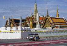 Opinion: Bangkok, a Most Visited City on Earth, and The Other Bangkok A Tuk Tuk drives past Grand Palace in Bangkok, Thailand on Aug. 3, 2021. Photo: Sakchai Lalit / AP
