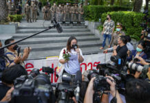 Opinion: How To Turn Thai Journalists Into PR Servants of the State Pro-democracy activist Panusaya Sithijirawattanakul talks to the media after leaving the Constitutional Court where her protest activities came under legal review in Bangkok, Thailand, Wednesday, Nov. 10, 2021. Photo: Sakchai Lalit / AP