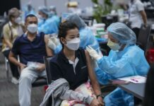 Asia Keeps Omicron at Bay So Far, But a Surge May Be Inevitable