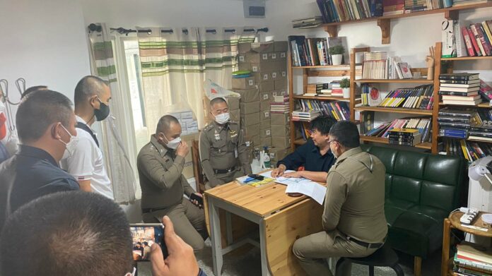 Police officers question Thanapol Eawsakul during a raid of Same Sky Books and Magazine office in Nonthaburi province on Jan. 20, 2022. Photo: Same Sky Books. Police officers question Thanapol Eawsakul during a raid of Same Sky Books and Magazine office in Nonthaburi province on Jan. 20, 2022. Photo: Same Sky Books.