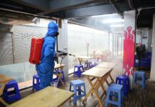 Thailand Raises COVID-19 Alert Level as Omicron Advances A worker disinfects a restaurant on Khaosan Road on Jan. 5, 2022.