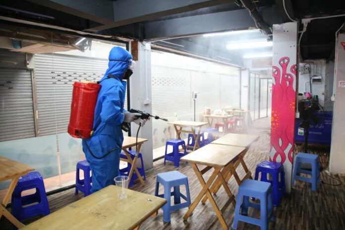 A worker disinfects a restaurant on Khaosan Road on Jan. 5, 2022. A worker disinfects a restaurant on Khaosan Road on Jan. 5, 2022.