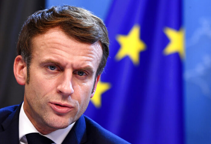 French President Emmanuel Macron addresses a media conference at the conclusion of an EU Summit in Brussels, Friday, Dec. 17, 2021. Photo: John Thys, Pool Photo via AP File