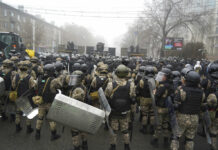 Dozens of Protesters, 12 Police Dead in Kazakhstan Protests Riot police block a street to prevent demonstrators during a protest in Almaty, Kazakhstan, Wednesday, Jan. 5, 2022. Photo: Vladimir Tretyakov / AP