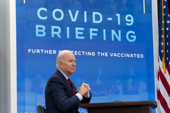 FILE - President Joe Biden meets with the White House COVID-19 Response Team on the latest developments related to the Omicron variant in the South Court Auditorium in the Eisenhower Executive Office Building on the White House Campus in Washington, Tuesday, Jan. 4, 2022. Photo: Andrew Harnik / AP File