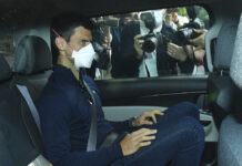 Djokovic Arrives in Dubai After Deportation From Australia Serbian tennis player Novak Djokovic rides in car as he leaves a government detention facility before attending a court hearing at his lawyers office in Melbourne, Australia, Sunday, Jan. 16, 2022. Photo: James Ross / AAP via AP
