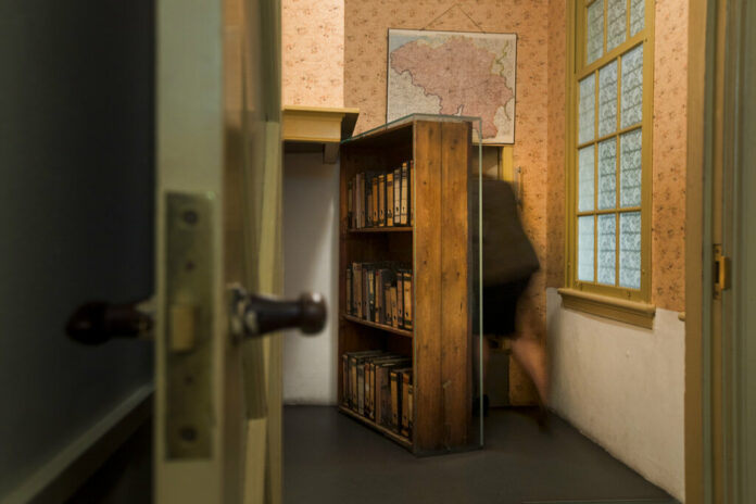 FILE - A woman enters the secret annex at the renovated Anne Frank House Museum in Amsterdam, Netherlands, Wednesday, Nov. 21, 2018. Photo: Peter Dejong / AP File