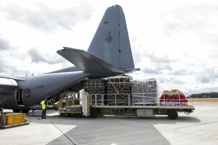 In this photo provided by the New Zealand Defence Force, a Royal New Zealand Air Force C-130 Hercules is loaded before it leaves an airbase in Auckland, Thursday, Jan. 20, 2022, flying to Tonga with aid. Photo: CPL Dillon Anderson / New Zealand Defence Force via AP
