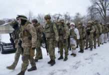 Russia Rejects UK Claim of Trying To Replace Ukraine Leader Members of Ukraine's Territorial Defense Forces, volunteer military units of the Armed Forces, train in a city park in Kyiv, Ukraine, Saturday, Jan. 22, 2022. Photo: Efrem Lukatsky / AP