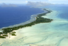 COVID Hits One of the Last Uninfected Places on the Planet FILE - In this March 30, 2004, file photo, Tarawa atoll, Kiribati, is seen in an aerial view. Photo: Richard Vogel / AP File)