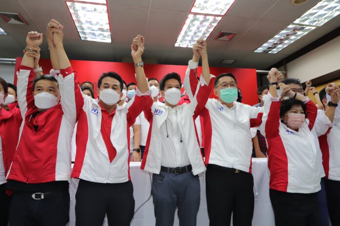 Pheu Thai MP candidate for Chatuchak-Lak Si constituency Surachart Thienthong celebrates his by-election victory at Pheu Thai Party headquarters on Jan. 30, 2022.