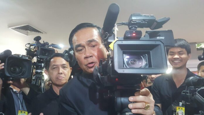 A file photo of PM Prayut Chan-o-cha operating a TV camera.