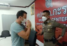 Greek Tourist’s Cash Stolen in Phuket Greek tourist Alexiadis Alexandos wais Karon police superintendent Teerawat Liamsuwan after a briefing at Karon Police Station on Feb. 2, 2022.
