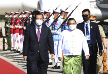 Myanmar Says It Won’t Attend ASEAN Foreign Ministers Meeting FILE - In this photo provided by An Khoun Sam Aun/National Television of Cambodia, Cambodian Prime Minister Hun Sen, left, reviews an honor guard with Myanmar Foreign Minister Wunna Maung Lwin, front right, on his arrival at Naypyitaw International Airport in Naypyitaw, Myanmar, on Jan 7, 2022. Photo: An Khoun Sam Aun / National Television of Cambodia via AP File