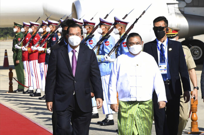 FILE - In this photo provided by An Khoun Sam Aun/National Television of Cambodia, Cambodian Prime Minister Hun Sen, left, reviews an honor guard with Myanmar Foreign Minister Wunna Maung Lwin, front right, on his arrival at Naypyitaw International Airport in Naypyitaw, Myanmar, on Jan 7, 2022. Photo: An Khoun Sam Aun / National Television of Cambodia via AP File FILE - In this photo provided by An Khoun Sam Aun/National Television of Cambodia, Cambodian Prime Minister Hun Sen, left, reviews an honor guard with Myanmar Foreign Minister Wunna Maung Lwin, front right, on his arrival at Naypyitaw International Airport in Naypyitaw, Myanmar, on Jan 7, 2022. Photo: An Khoun Sam Aun / National Television of Cambodia via AP File