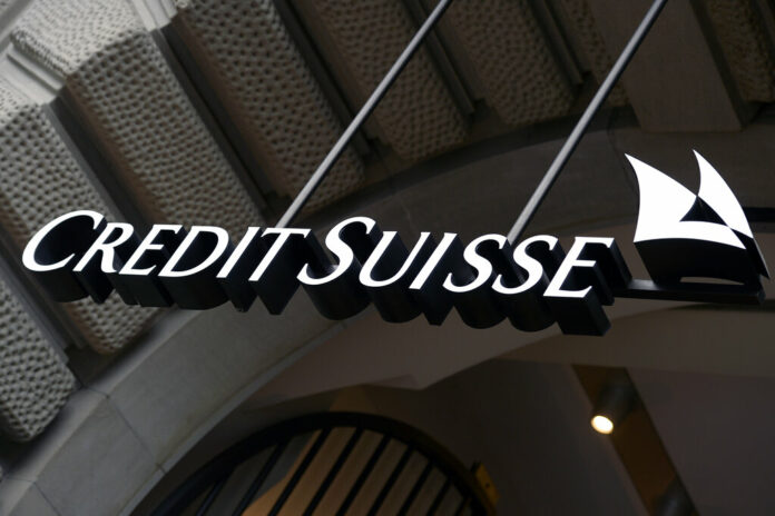 FILE - The logo of the Swiss bank Credit Suisse is seen on a building in Zurich, Switzerland, Oct. 21, 2015. Photo: Walter Bieri / Keystone via AP File