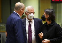 EU Sanctions 22 Myanmar Officials, Gas Company, Over Abuses German Foreign Minister Annalena Baerbock, right, speaks with Poland's Foreign Minister Zbiegniew Rau, left, and European Union foreign policy chief Josep Borrell during a meeting of EU foreign ministers in Brussels, Monday, Feb. 21, 2022. Photo: Virginia Mayo / AP