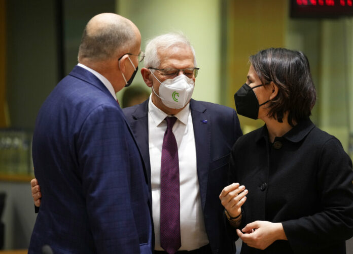 German Foreign Minister Annalena Baerbock, right, speaks with Poland's Foreign Minister Zbiegniew Rau, left, and European Union foreign policy chief Josep Borrell during a meeting of EU foreign ministers in Brussels, Monday, Feb. 21, 2022. Photo: Virginia Mayo / AP German Foreign Minister Annalena Baerbock, right, speaks with Poland's Foreign Minister Zbiegniew Rau, left, and European Union foreign policy chief Josep Borrell during a meeting of EU foreign ministers in Brussels, Monday, Feb. 21, 2022. Photo: Virginia Mayo / AP