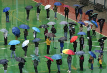 Hong Kong Orders Mandatory COVID-19 Tests for All Residents Residents line up to get tested for the coronavirus at a temporary testing center despite the rain in Hong Kong, Tuesday, Feb. 22, 2022. Photo: Kin Cheung / AP