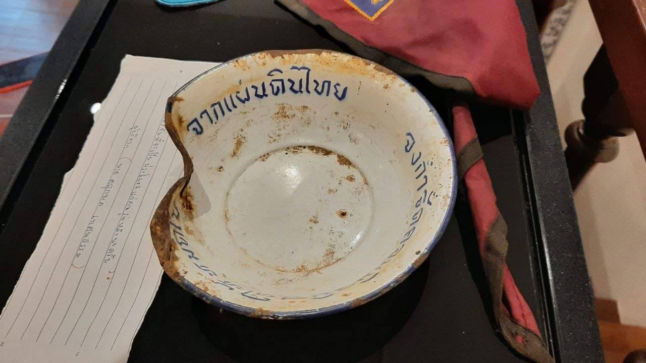 A Cold-War era metal bowl with anti-Communist message printed on.