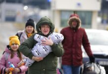 Refugee Count Tops 1 Million; Russians Besiege Ukraine Ports A family arrive at the border crossing in Medyka, Poland, Wednesday, March 2, 2022, after fleeing from the Ukraine. Photo: Markus Schreiber / AP