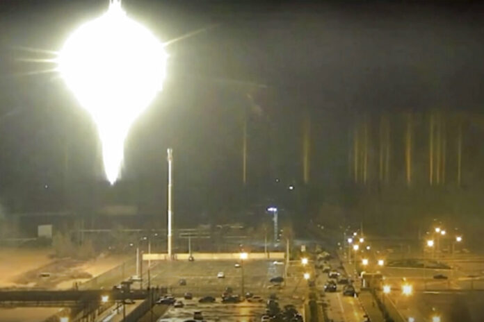 This image made from a video released by Zaporizhzhia nuclear power plant shows bright flaring object landing in grounds of the nuclear plant in Enerhodar, Ukraine Friday, March 4, 2022. Photo: Zaporizhzhia nuclear power plant via AP