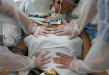 Death Toll Surpasses 6 Million for Pandemic Now in 3rd Year FILE - Nurses perform timed breathing exercises on a COVID-19 patient on a ventilator in the COVID-19 intensive care unit at the la Timone hospital in Marseille, southern France, Friday, Dec. 31, 2021. Photo: Daniel Cole / AP File