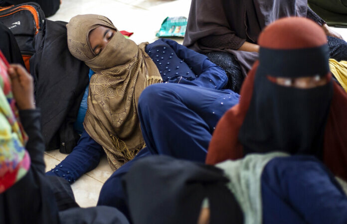 Ethnic Rohingya people rest at a temporary shelter in Bireuen, Aceh province, Indonesia, Sunday, March 6, 2022. Photo: Zik Maulana / AP