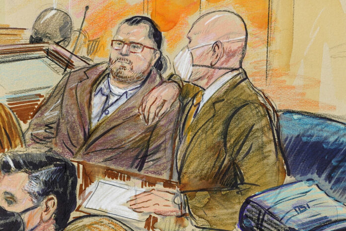 FILE - This artist sketch depicts Guy Wesley Reffitt, joined by his lawyer William Welch, right, in Federal Court, in Washington, on Feb. 28, 2022. Image: Dana Verkouteren via AP