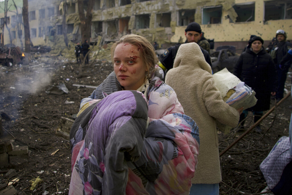 FILE - Mariana Vishegirskaya stands outside a maternity hospital that was damaged by shelling in Mariupol, Ukraine, March 9, 2022. Photo: Mstyslav Chernov / AP File