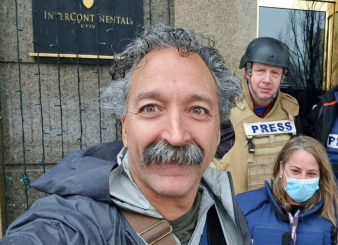 This image released by Fox News Channel shows cameraman Pierre Zakrzewski while on assignment with colleagues, Fox News correspondent Steve Harrigan and Jerusalem-based senior producer Yonat Friling, background right, in Kyiv. Zakrzewski was killed in Ukraine on Monday, March 14, 2022, when the vehicle he was traveling in was struck by incoming fire. Photo: Pierre Zakrzewski / Fox News via AP