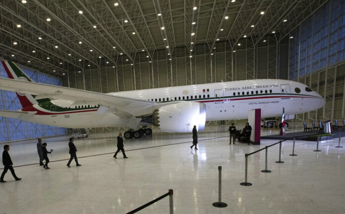 FILE - In this July 27, 2020 file photo, Mexican President Andres Manuel Lopez Obrador, center left, waves to the press as he arrives to give his daily, morning press conference in front of the former presidential plane at Benito Juarez International Airport in Mexico City. Photo: Marco Ugarte / AP File