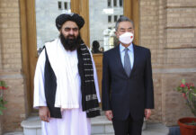 China’s Xi Strongly Backs Afghanistan at Regional Conference In this photo released by Xinhua News Agency, Chinese Foreign Minister Wang Yi, right, poses for photos with Amir Khan Muttaqi, acting foreign minister of the Afghan Taliban's caretaker government, in Kabul, Afghanistan on March 24, 2022. Photo: Saifurahman Safi / Xinhua via AP