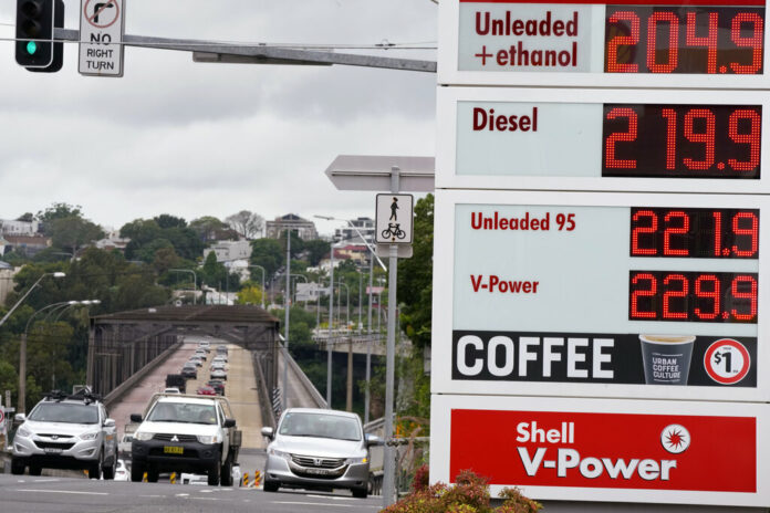 FILE - Motorists drive past a fuel price display in Sydney, Tuesday, March 29, 2022. Photo: Rick Rycroft / AP File